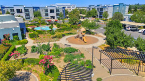 Aerial photo of The Ridge playground, pergola, community garden, and swimming pool
